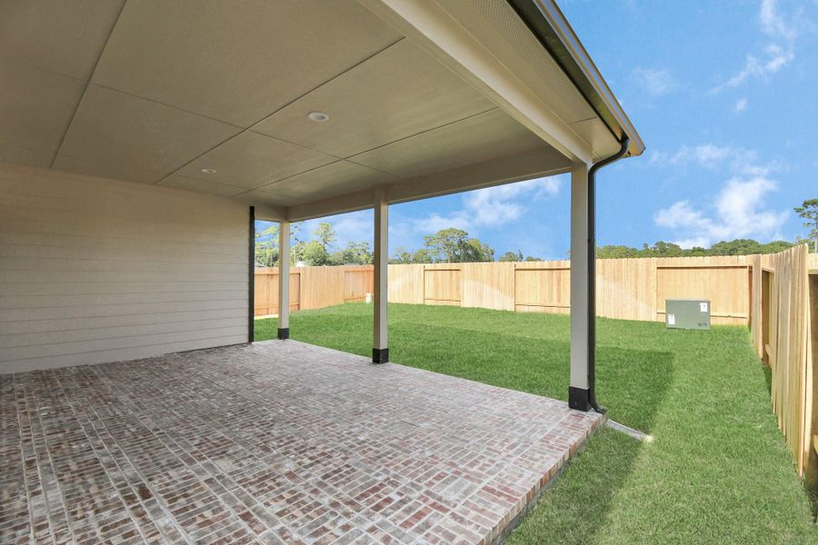 Experience outdoor living at its finest on this expansive covered patio, thoughtfully designed for BBQs and delightful outdoor dining Experience outdoor living at its finest on this expansive covered patio, thoughtfully designed for BBQs and delightful outdoor dining