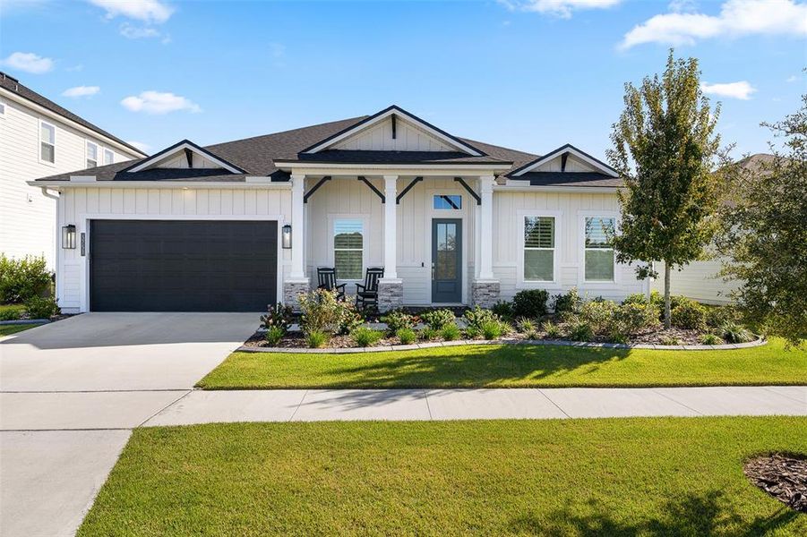 Front exterior of a new home in Oakmont, Gainesville, FL, highlighting curb appeal (Image 27).