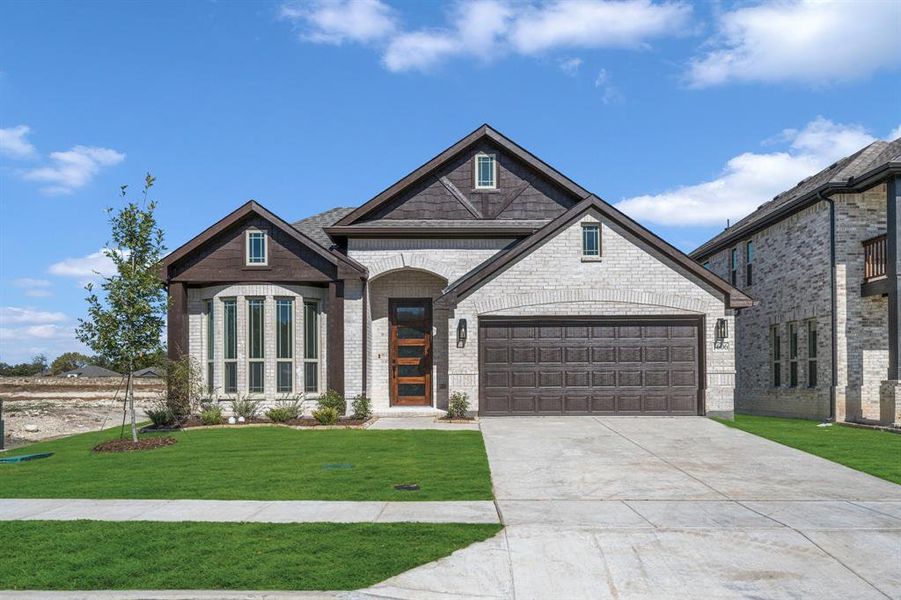 Front exterior of a new home in Anderson Crossing, Trenton, TX, highlighting curb appeal (Image 17). Front exterior of a new home in Anderson Crossing, Trenton, TX, highlighting curb appeal (Image 17).