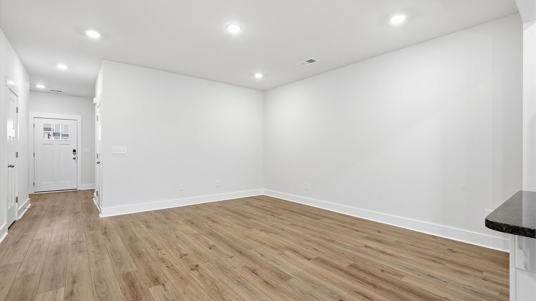 First-rate family room with thoughtful layout and superior connection to kitchen and dining spaces at Aspen Ridge
