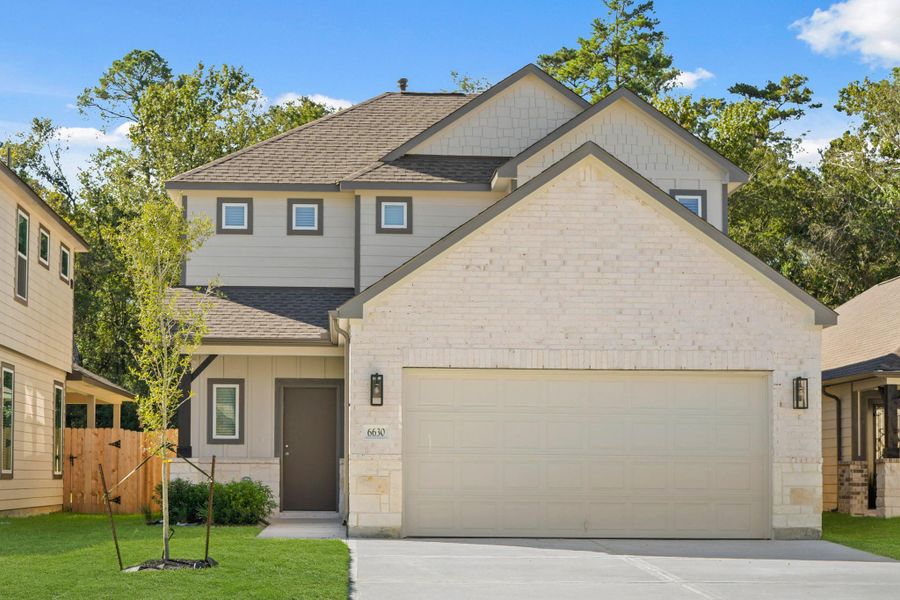 Front exterior of a new home in Cypresswood Landing, Humble, TX, highlighting curb appeal (Image 14).