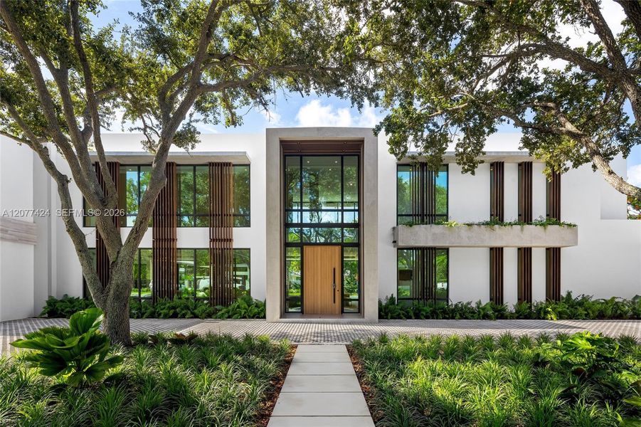 Front exterior of a new home in , Pinecrest, FL, highlighting curb appeal (Image 1). Front exterior of a new home in , Pinecrest, FL, highlighting curb appeal (Image 1).