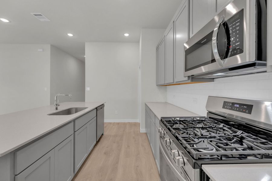 Kitchen in the Evelyn Pecos model home in Austin TX by Trophy Signature Homes