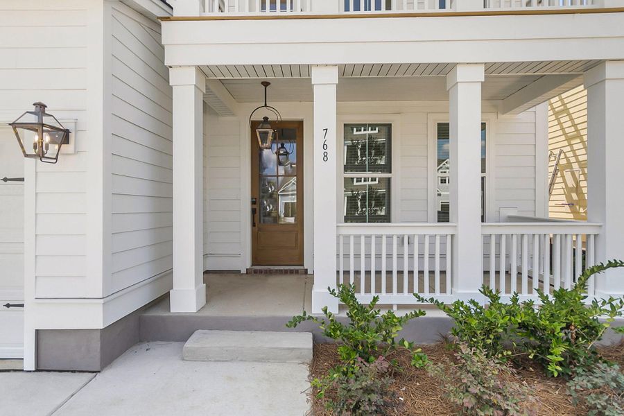 Exterior details and patio area of a home in Tidewater at Lakes of Cane Bay, Summerville (Image 3).