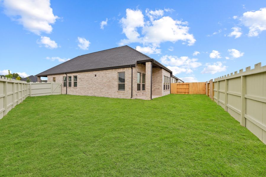 Front exterior of a new home in Wood Leaf Reserve, Tomball, TX, highlighting curb appeal (Image 19).