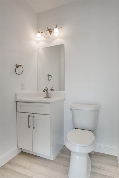 Bathroom with vanity and light wood-style floors Bathroom with vanity and light wood-style floors