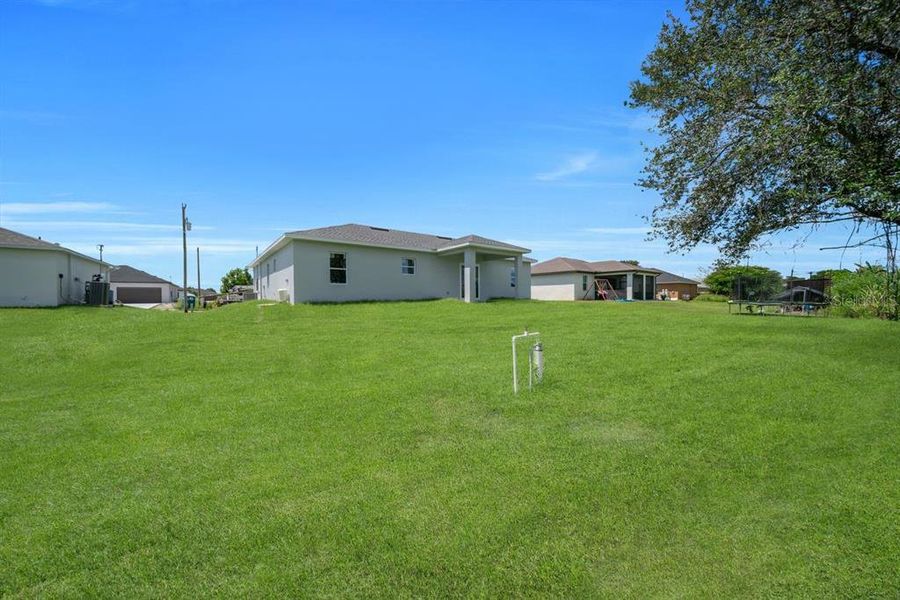 Front exterior of a new home in , Lehigh Acres, FL, highlighting curb appeal (Image 16). Front exterior of a new home in , Lehigh Acres, FL, highlighting curb appeal (Image 16).