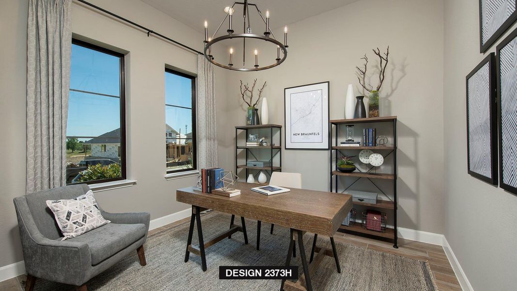 Home office with plenty of natural light, a chandelier, and light wood-style flooring Home office with plenty of natural light, a chandelier, and light wood-style flooring