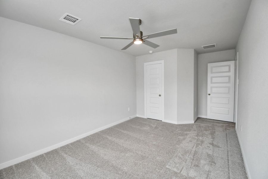 Generously sized secondary bedrooms featuring spacious closets, soft and inviting carpeting underfoot, large windows allowing plenty of natural light, and the added touch of privacy blinds for your personal retreat. Sample photo of completed home with similar floor plan. Actual colors and selections may vary. Generously sized secondary bedrooms featuring spacious closets, soft and inviting carpeting underfoot, large windows allowing plenty of natural light, and the added touch of privacy blinds for your personal retreat. Sample photo of completed home with similar floor plan. Actual colors and selections may vary.