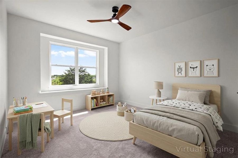 The room features a large window providing natural light, a ceiling fan, and carpeted flooring The room features a large window providing natural light, a ceiling fan, and carpeted flooring