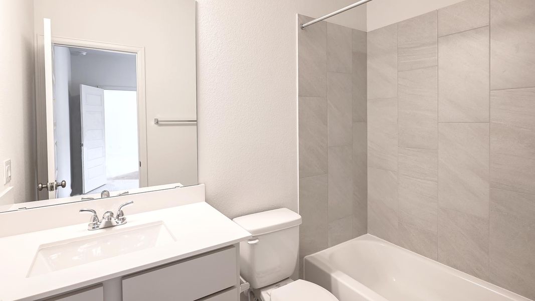 Furnished interior view inside a new home in Crosswinds 50', Kyle (Image 8).