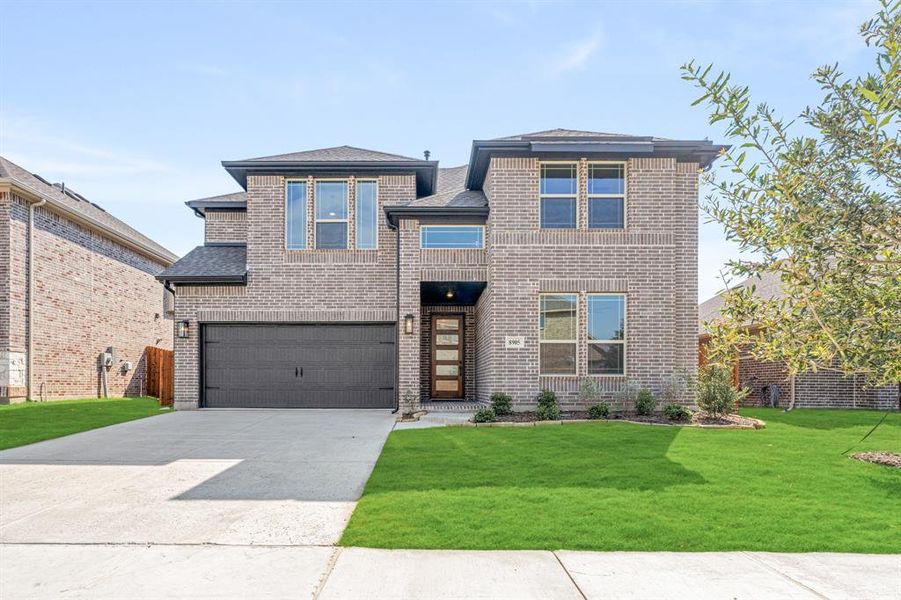 Front exterior of a new home in Country Lakes Classic 60, Argyle, TX, highlighting curb appeal (Image 19). Front exterior of a new home in Country Lakes Classic 60, Argyle, TX, highlighting curb appeal (Image 19).