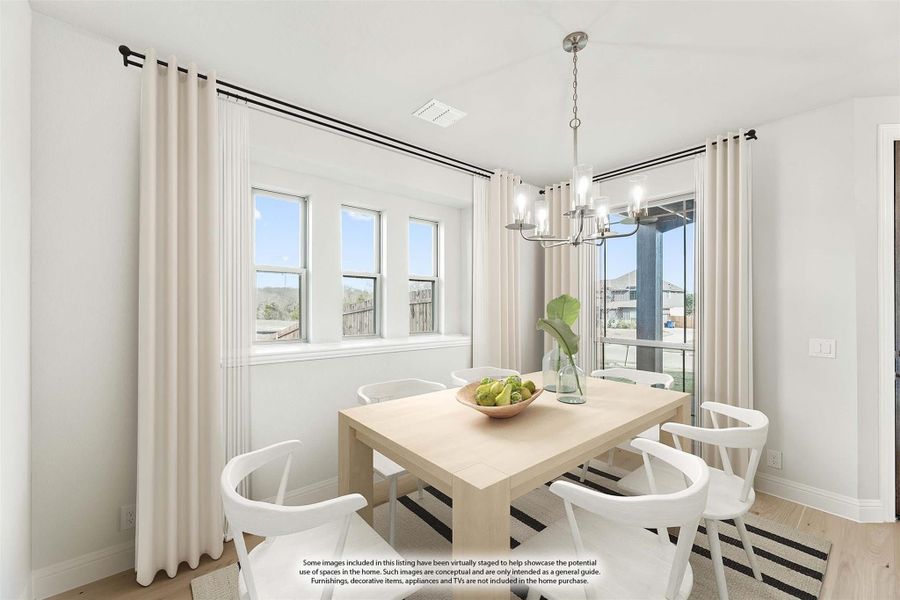 Bright dining room with light wood table, white chairs, chandelier, and large windows with floor-length curtains Bright dining room with light wood table, white chairs, chandelier, and large windows with floor-length curtains