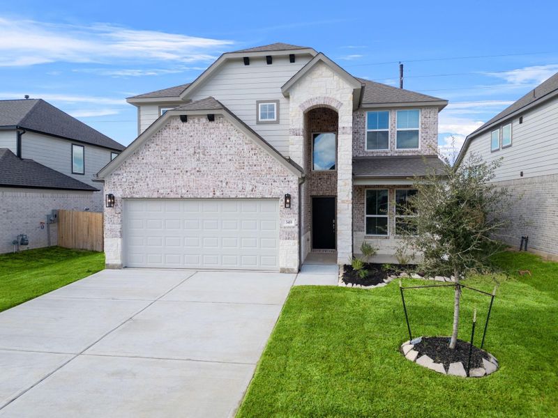 Front exterior of a new home in Beacon Hill, Waller, TX, highlighting curb appeal (Image 14). Front exterior of a new home in Beacon Hill, Waller, TX, highlighting curb appeal (Image 14).