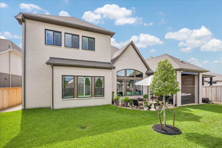 Exterior details and patio area of a home in Prairieland Village - Summit Collection, Cypress (Image 21).