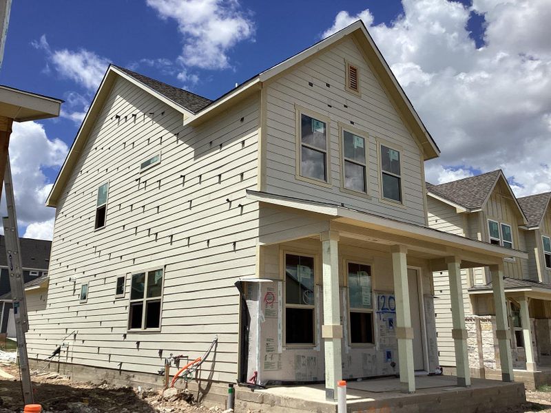 Front exterior of a new home in The Cottages at Lariat, Liberty Hill, TX, highlighting curb appeal (Image 14). Front exterior of a new home in The Cottages at Lariat, Liberty Hill, TX, highlighting curb appeal (Image 14).