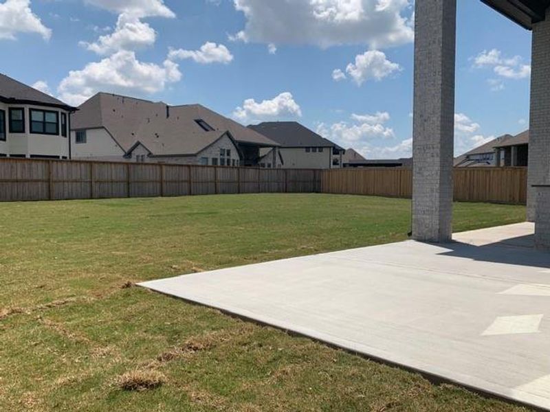 Exterior details and patio area of a home in Dunham Pointe, Cypress (Image 26).