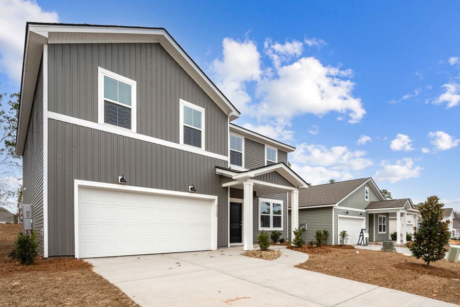 Front exterior of a new home in Grand Arbor, Blythewood, SC, highlighting curb appeal (Image 17).