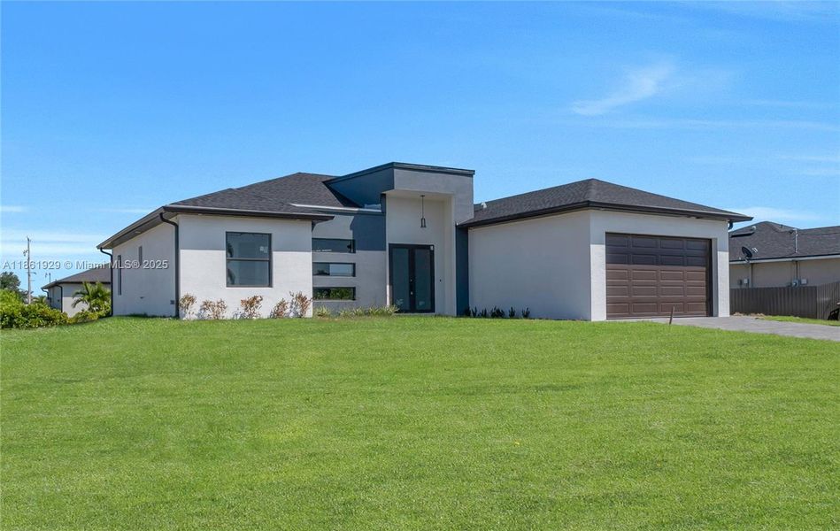 Front exterior of a new home in , Cape Coral, FL, highlighting curb appeal (Image 2). Front exterior of a new home in , Cape Coral, FL, highlighting curb appeal (Image 2).