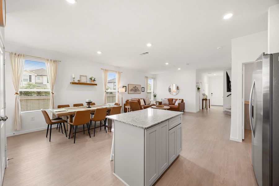 The thoughtfully designed open-concept layout offers clear sightlines from the kitchen to the dining and living areas, creating a welcoming space for everyday living and entertaining.