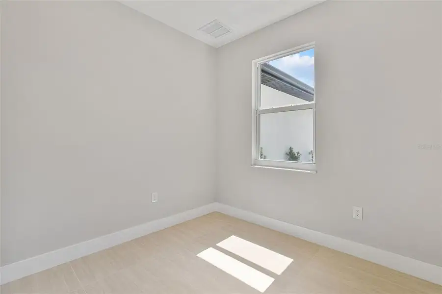 Spacious, unfurnished interior of a new home in , Port Charlotte (Image 41).