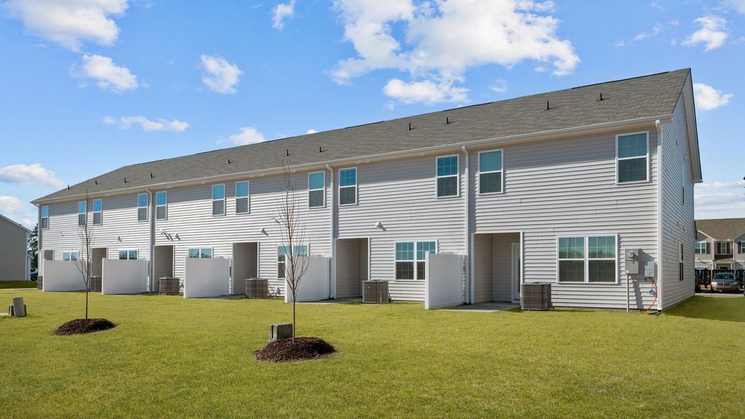Exterior details and patio area of a home in The Townes at Ridgewood Farms, Winterville (Image 24).
