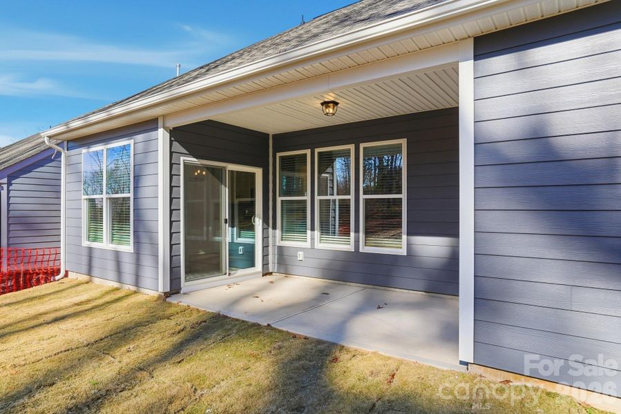 Exterior details and patio area of a home in Villas at Prestwick, Mooresville (Image 21).