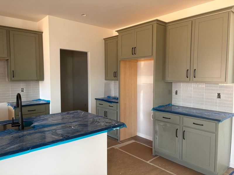 Kitchen featuring the AW Collection® Rosemary - Matte black, light wood, and garden-inspired style. Kitchen featuring the AW Collection® Rosemary - Matte black, light wood, and garden-inspired style.