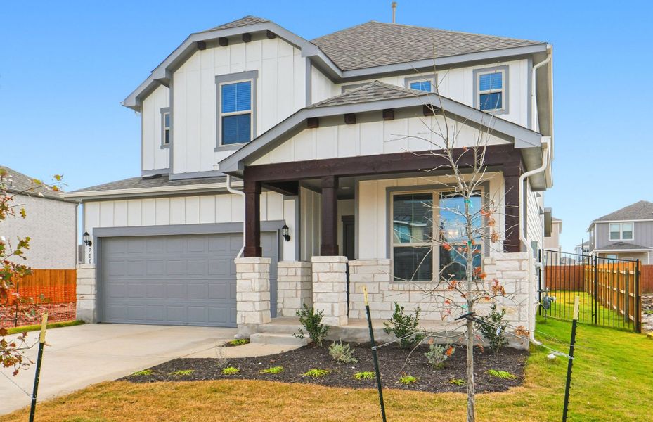 Front exterior of a new home in Santa Rita Ranch, Liberty Hill, TX, highlighting curb appeal (Image 24). Front exterior of a new home in Santa Rita Ranch, Liberty Hill, TX, highlighting curb appeal (Image 24).