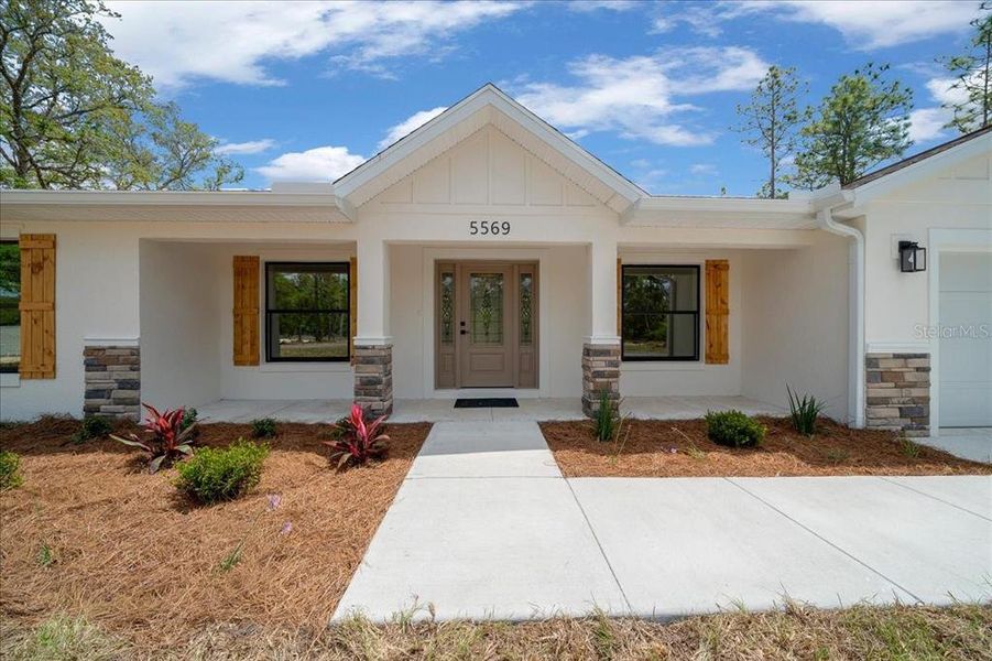 Front exterior of a new home in , Ocala, FL, highlighting curb appeal (Image 25).