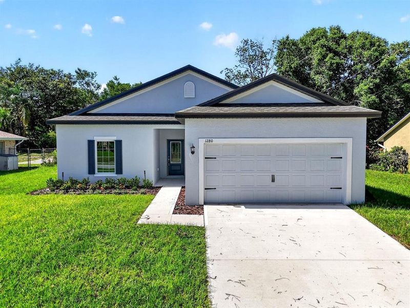 Front exterior of a new home in , Deltona, FL, highlighting curb appeal (Image 22).