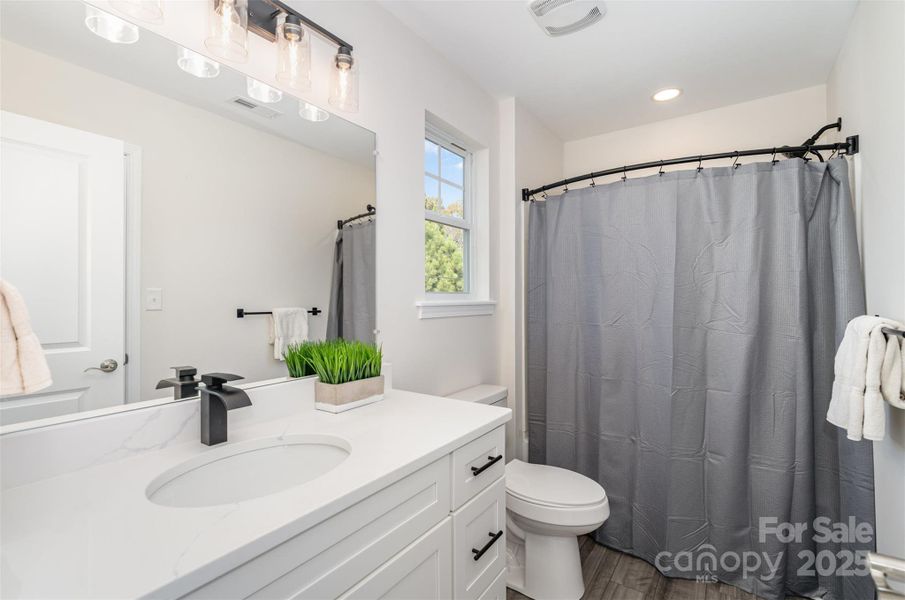 Shared full bath between second bedroom and flex room. Shared full bath between second bedroom and flex room.