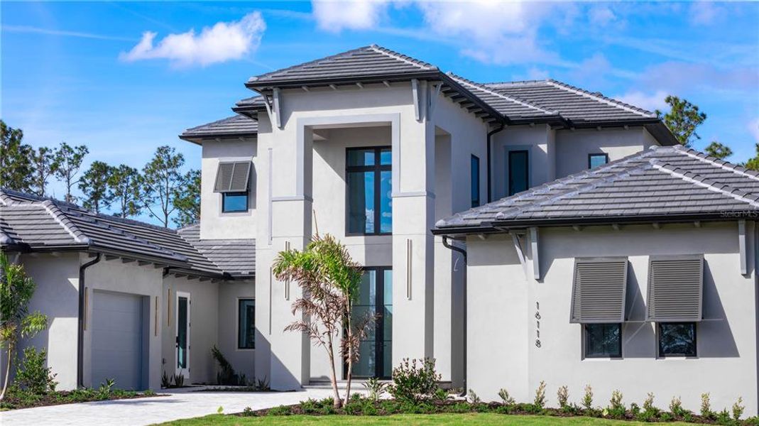 Front exterior of a new home in , Montverde, FL, highlighting curb appeal (Image 26). Front exterior of a new home in , Montverde, FL, highlighting curb appeal (Image 26).