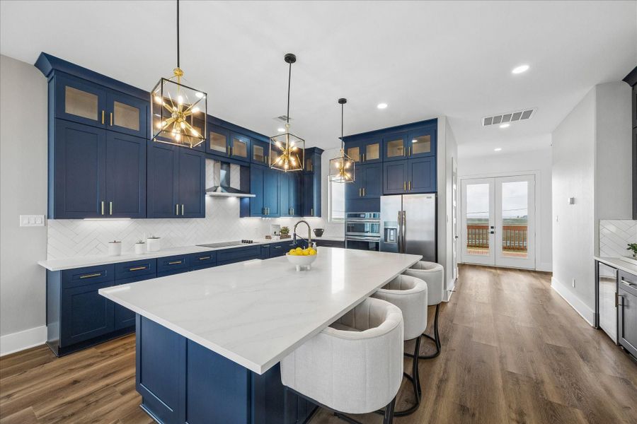 Blue kitchen cabinetry beautifully compliments the beach aesthetic. Blue kitchen cabinetry beautifully compliments the beach aesthetic.
