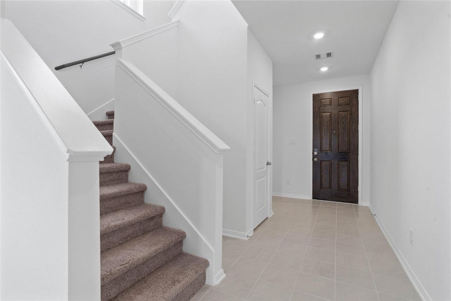 The entryway is bright and spacious while the staircase leads you to the 2nd floor bedrooms and bathrooms.
