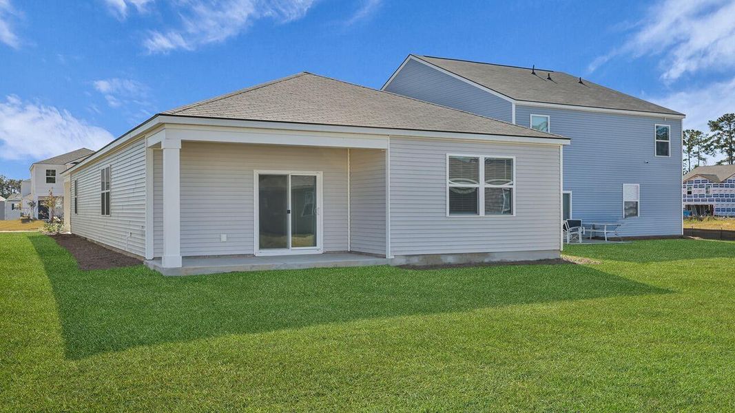 Exterior details and patio area of a home in Pine Hills at Cane Bay, Summerville (Image 24).
