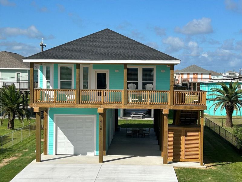 Front exterior of a new home in , Galveston, TX, highlighting curb appeal (Image 2).