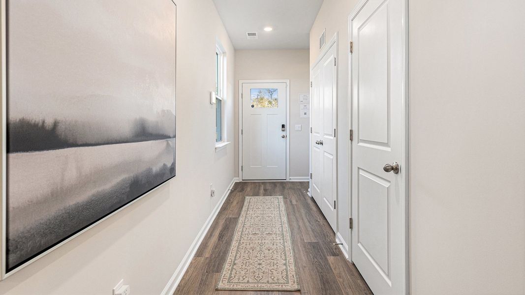 Representative unfurnished interior of a home built from the DOWNING by D.R. Horton in Southshore Bay, Sunset Beach (Image 12).