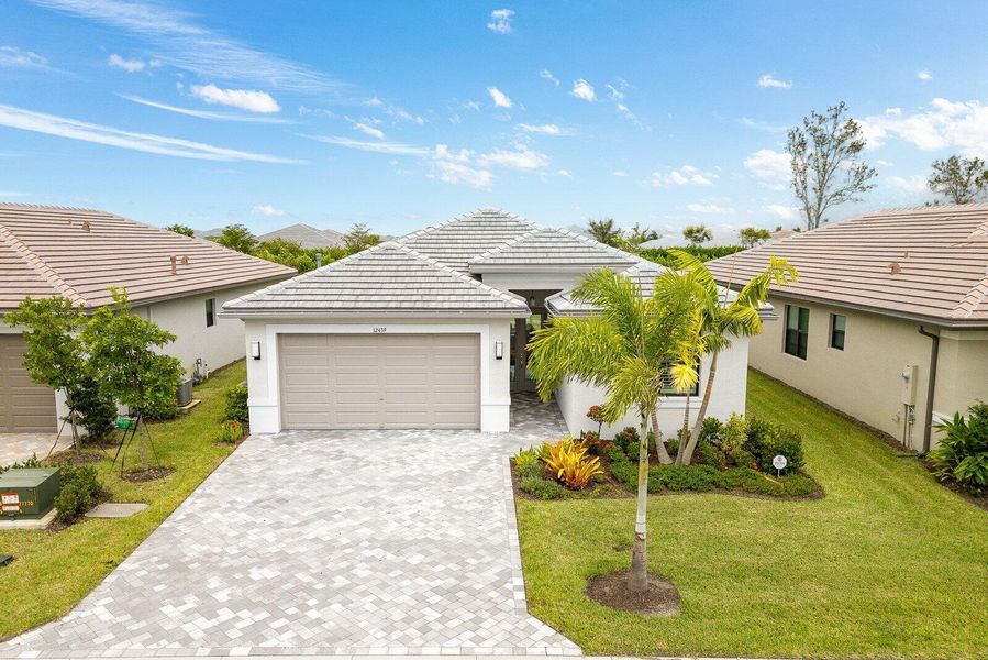 Front exterior of a new home in , Port St. Lucie, FL, highlighting curb appeal (Image 1). Front exterior of a new home in , Port St. Lucie, FL, highlighting curb appeal (Image 1).