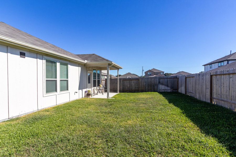 Exterior details and patio area of a home in Mustang Ridge, Alvin (Image 4). Exterior details and patio area of a home in Mustang Ridge, Alvin (Image 4).