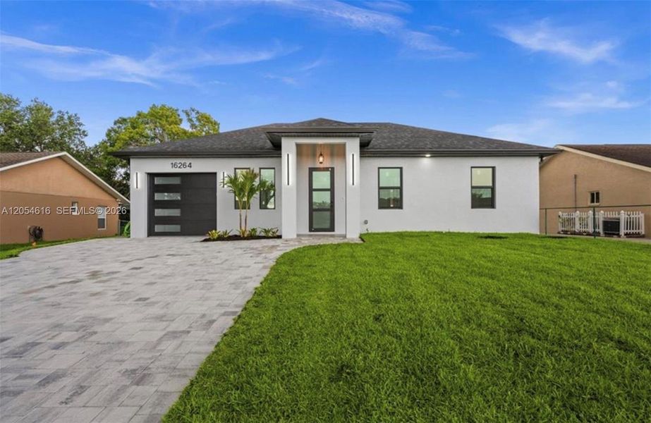 Front exterior of a new home in , North Fort Myers, FL, highlighting curb appeal (Image 1). Front exterior of a new home in , North Fort Myers, FL, highlighting curb appeal (Image 1).
