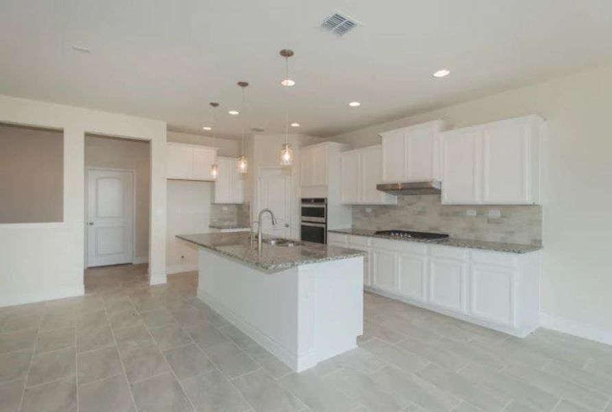 Photo of Pulte home with same floor plan, not of actual home listed.