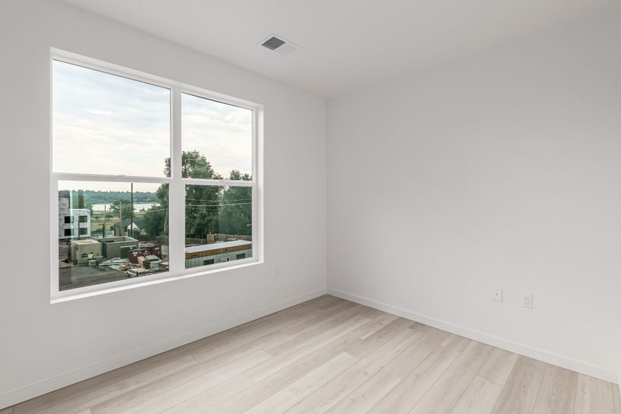 Spacious, unfurnished interior of a new home in The Scene at Sloan's Lake, Denver (Image 6).