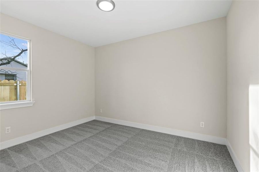 Spare room with light colored carpet