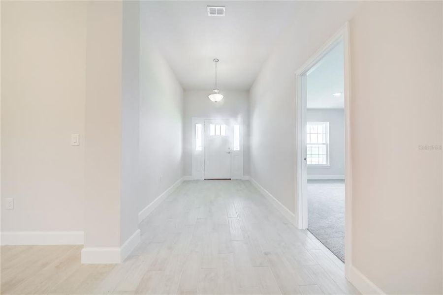 Spacious, unfurnished interior of a new home in Aviary at Rutland Ranch, Parrish (Image 20).