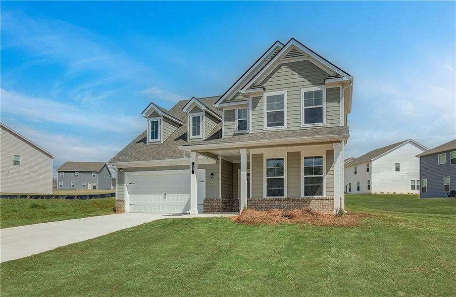 Front exterior of a new home in Chapel Hill, Newnan, GA, highlighting curb appeal (Image 2). Front exterior of a new home in Chapel Hill, Newnan, GA, highlighting curb appeal (Image 2).