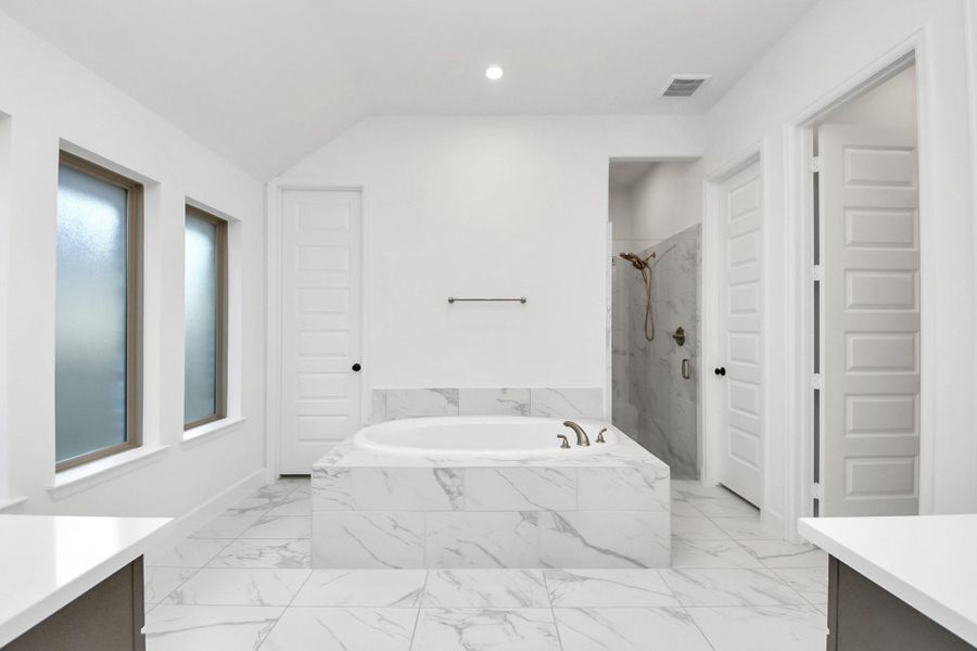 Primary Bathroom with huge tub, walk in shower, his/her closets Primary Bathroom with huge tub, walk in shower, his/her closets