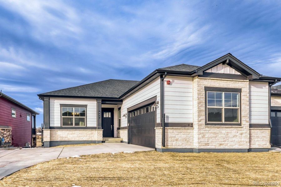 Front exterior of a new home in Knolls, Westminster, CO, highlighting curb appeal (Image 22). Front exterior of a new home in Knolls, Westminster, CO, highlighting curb appeal (Image 22).