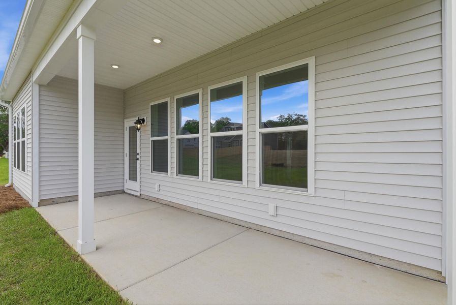 Exterior details and patio area of a home in The Oaks, Goose Creek (Image 3).