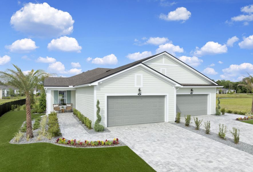 Front exterior of a new home in RiverTown - WaterSong, St. Johns, FL, highlighting curb appeal (Image 16).